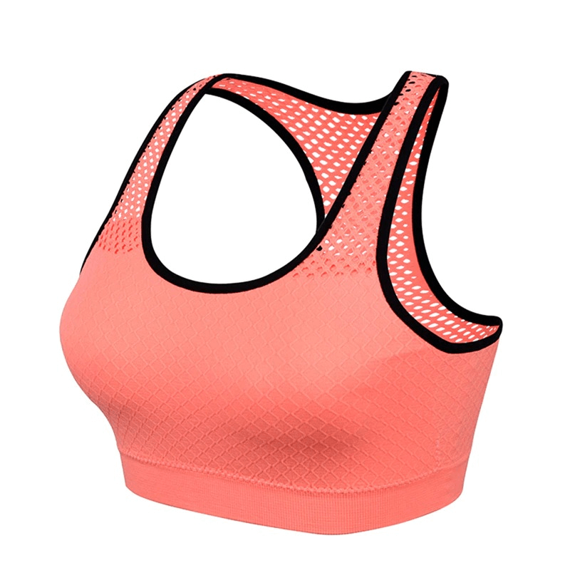 Women's seamless yoga top in coral pink with mesh design, quick-dry and lightweight, ideal for workouts.